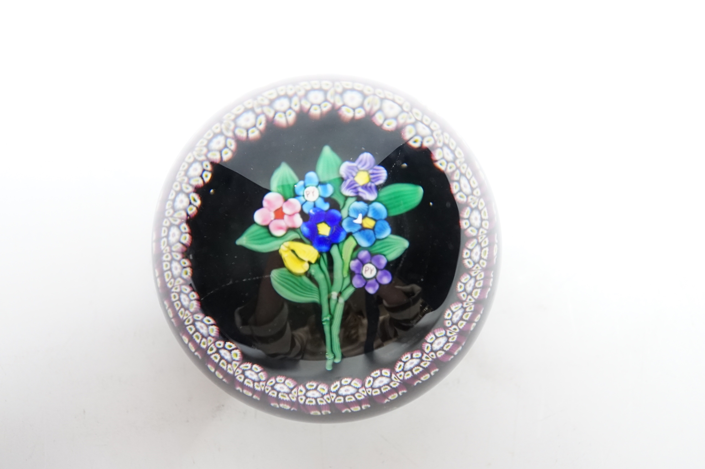 A rare Paul Ysart ‘small flower bouquet’ paperweight with double ‘PY’ cane, Caithness period, CG paper label to base, 7.5cm
